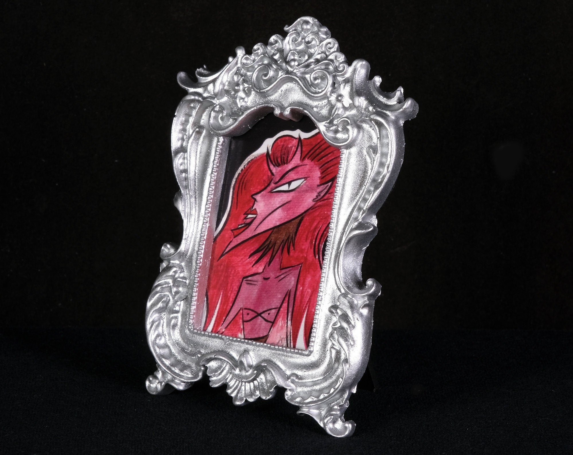 Red Haired Tiny Demon Framed Print