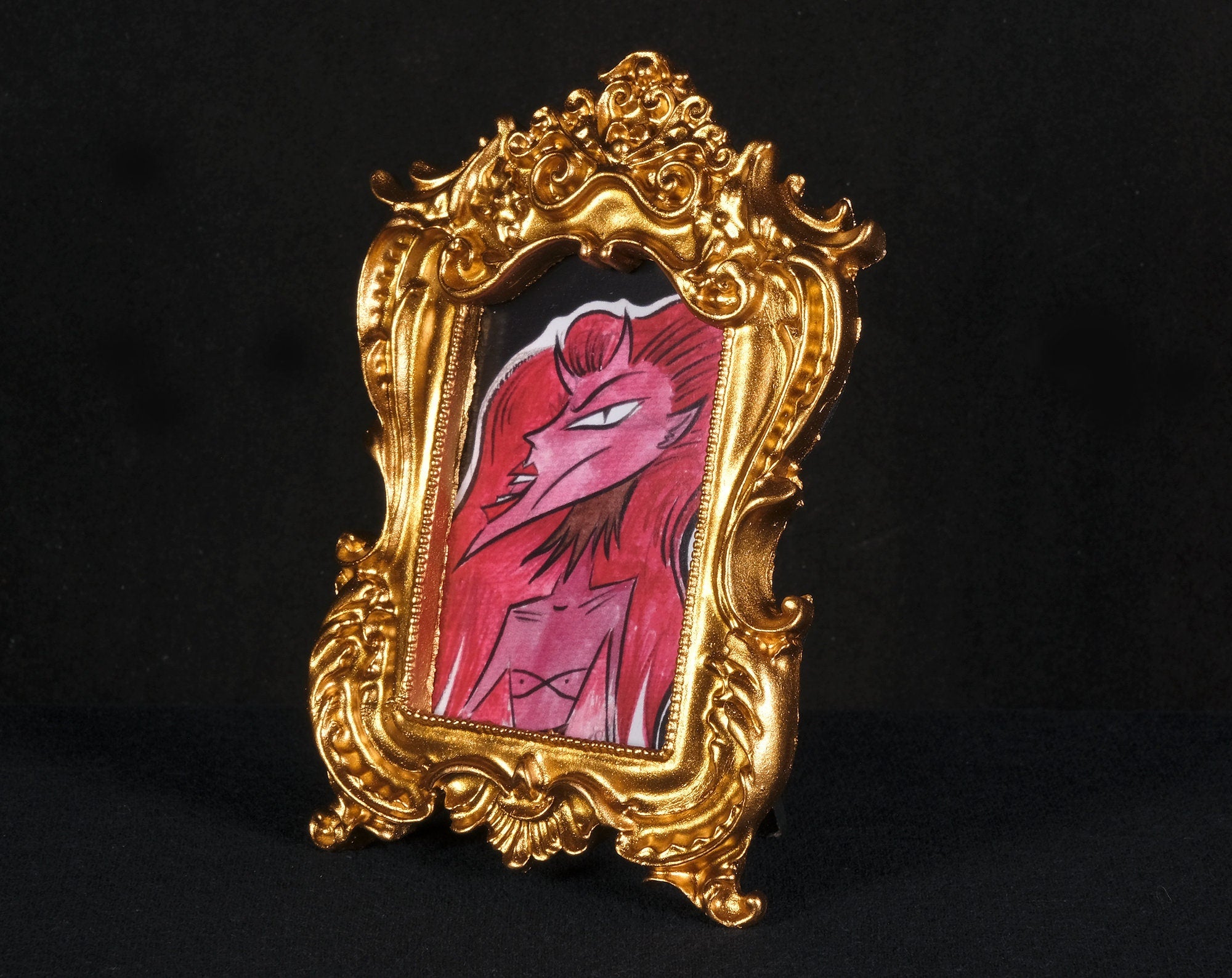 Red Haired Tiny Demon Framed Print