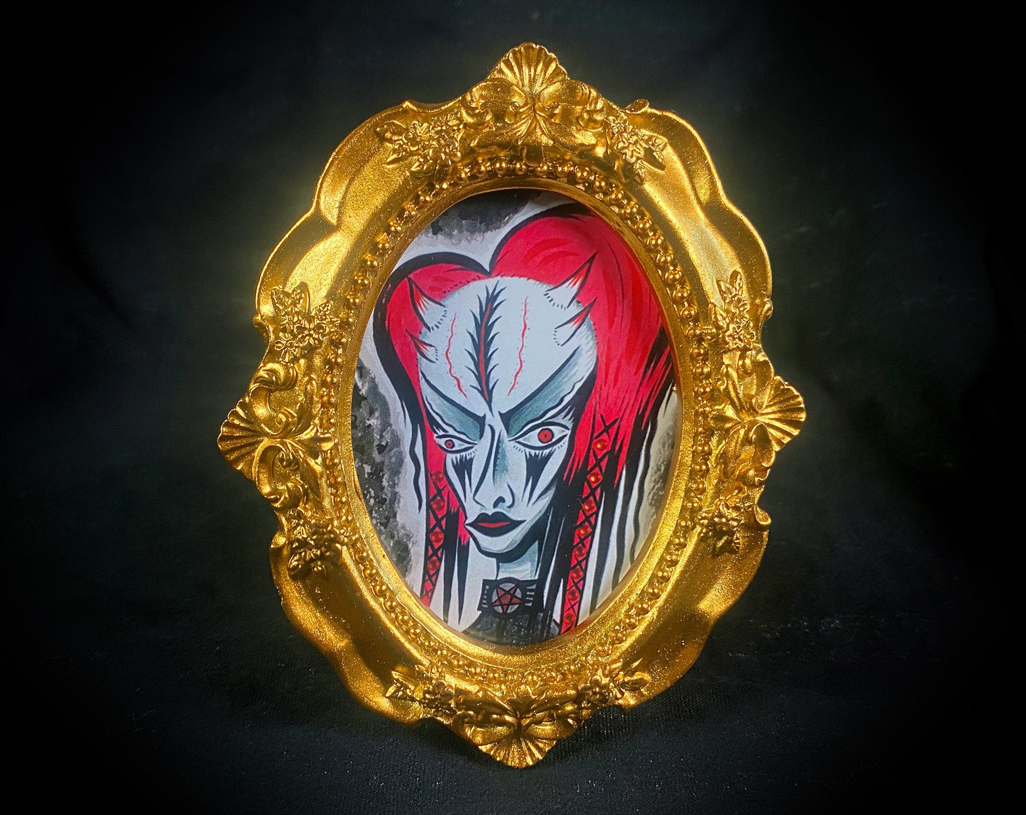 Scar Headed Tiny Demon Framed Print