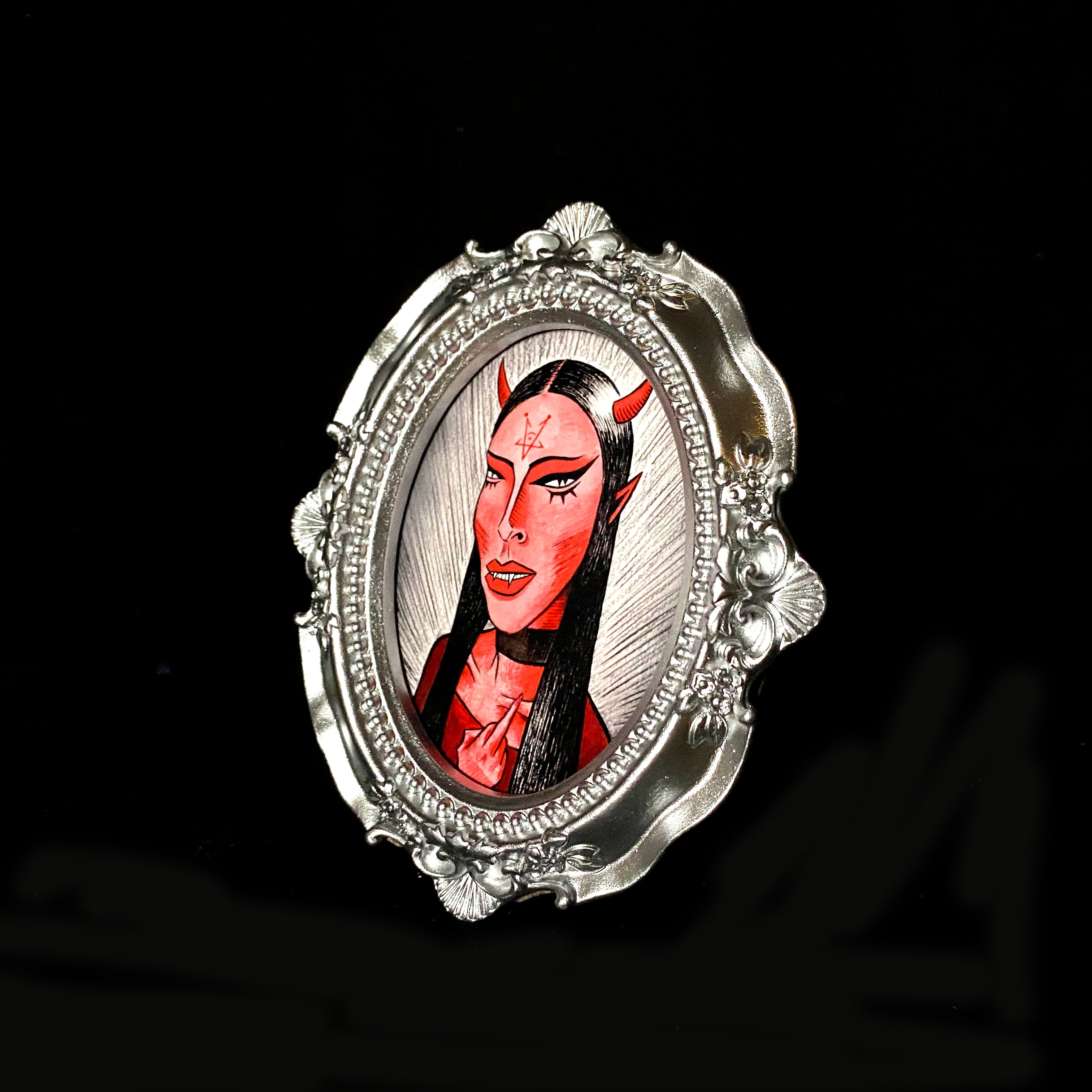 Finger Tiny Demon Framed Print