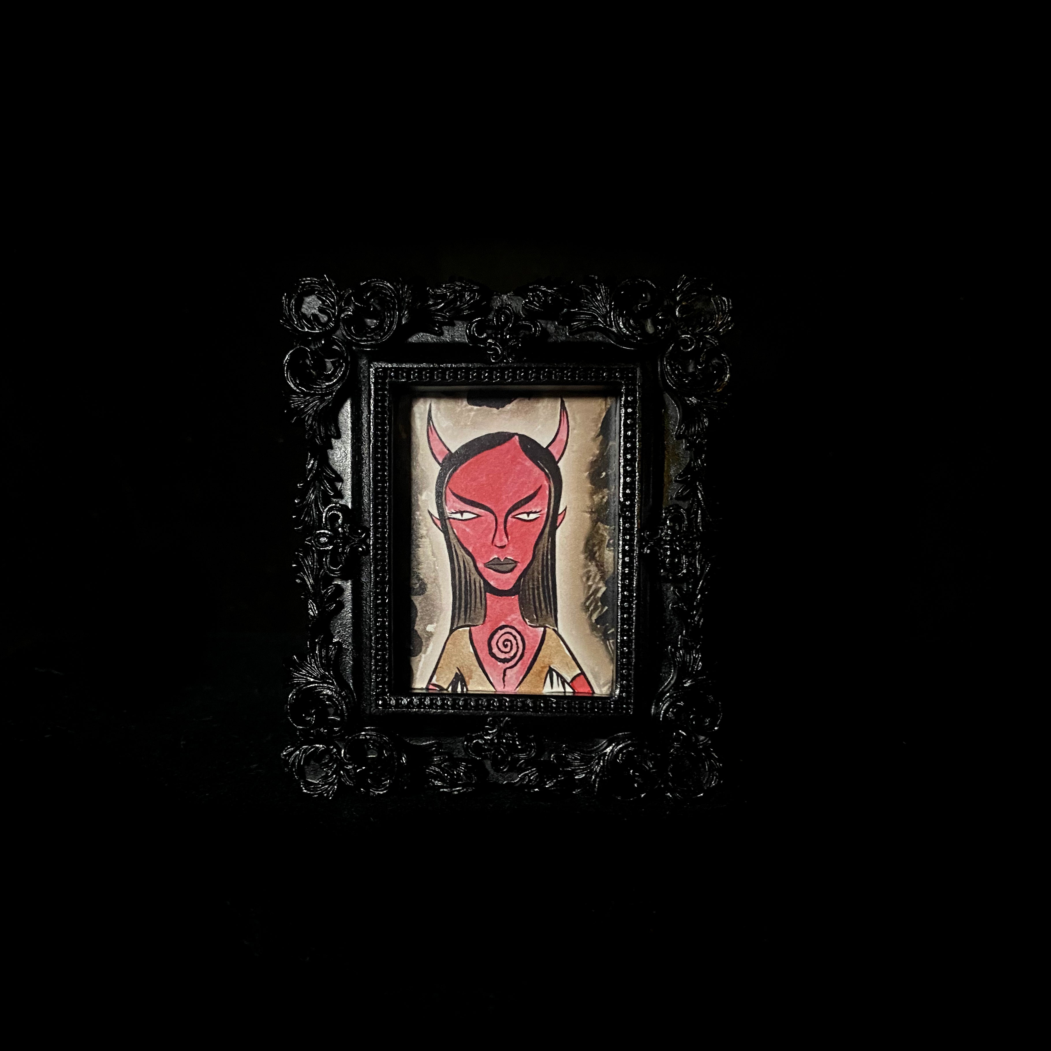 Spiral Tiny Demon Framed Print